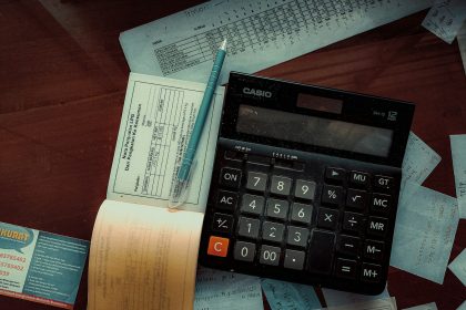 a calculator sitting on top of a wooden table