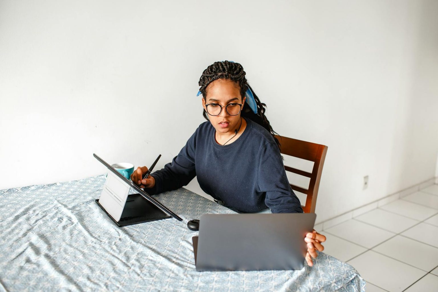 Woman Working on Laptop and Tablet