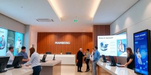 Modern bank interior with customers and staff interaction.