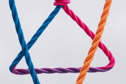 Close-up of a colorful triangular rope arrangement.