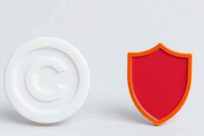 Photograph of copyright and trademark objects on neutral background.